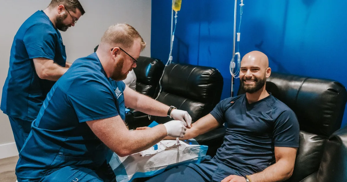 Client relaxing during an IV vitamin drip at iCRYO New Braunfels, TX
