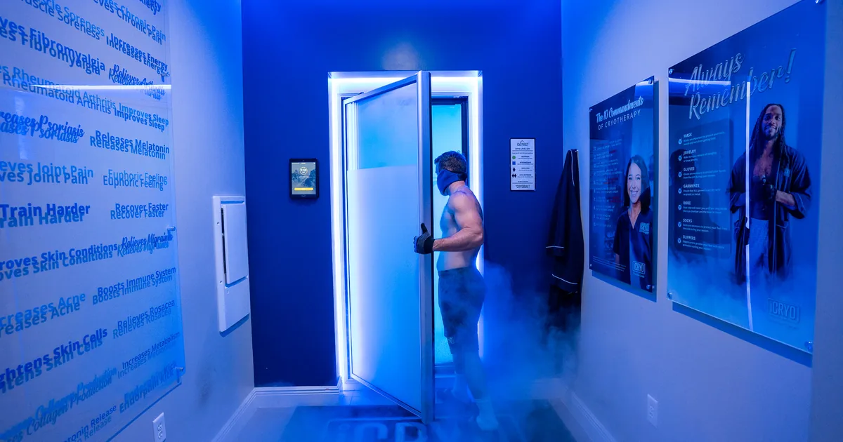 Client in a whole-body cryotherapy chamber with cold vapor at iCRYO New Braunfels, TX