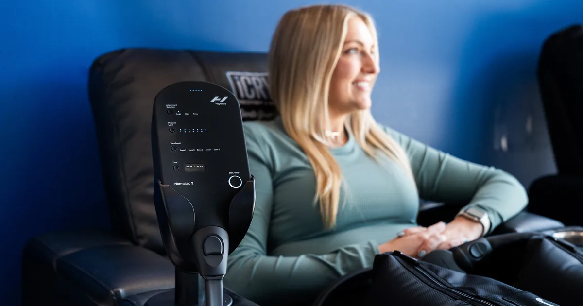 Runner relaxing during compression therapy for recovery at iCRYO New Braunfels