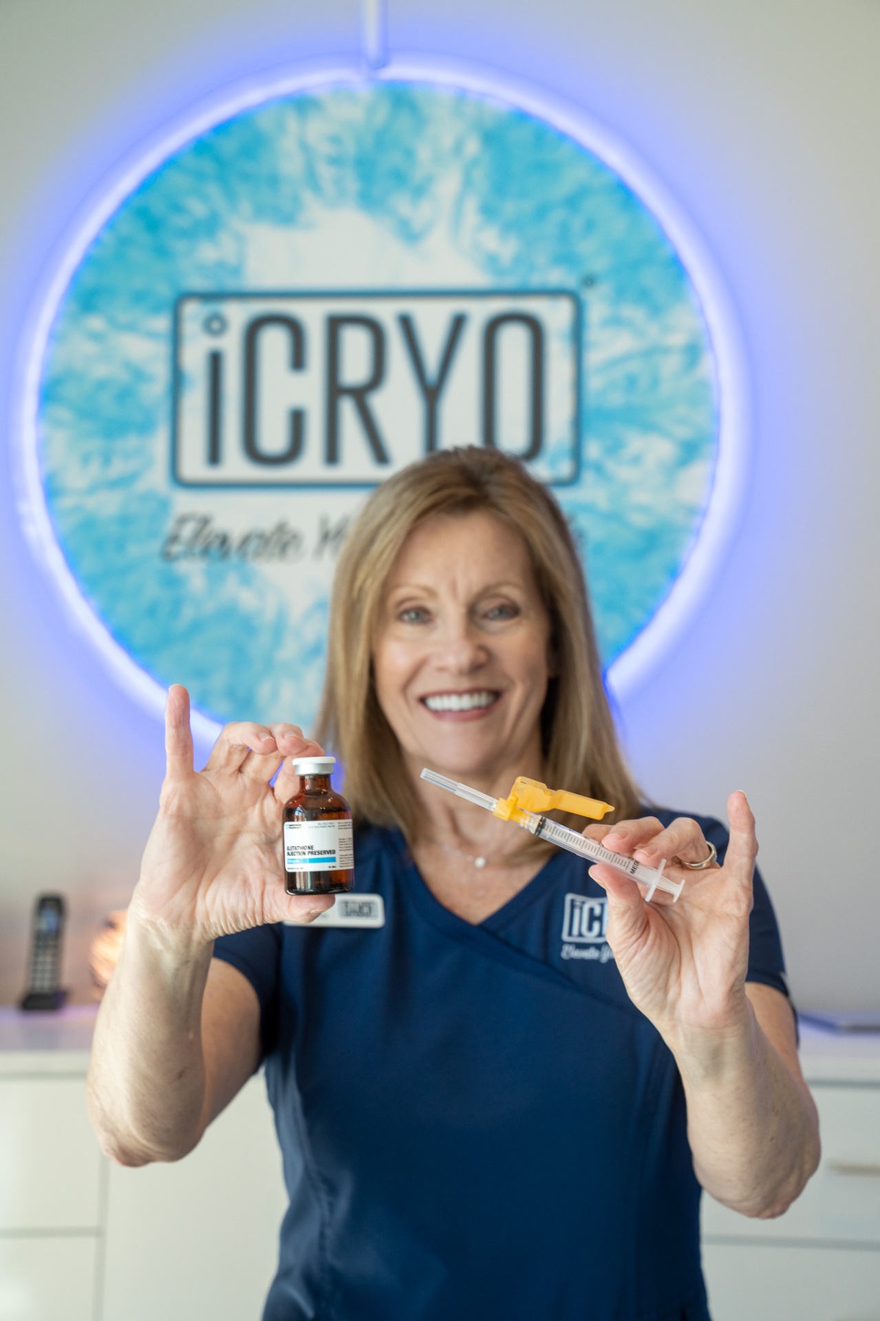 iCRYO New Braunfels registered nurse holding glutathione IM shot vial and syringe