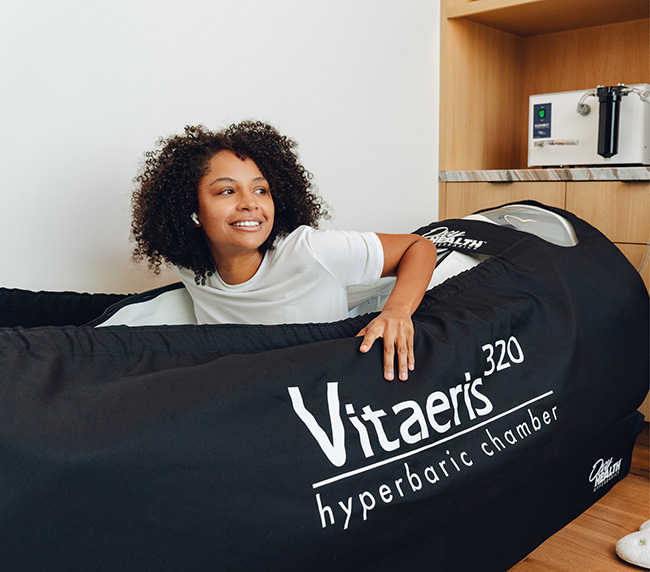 Guest relaxing inside the Vitaeris 320 hyperbaric chamber at iCRYO New Braunfels